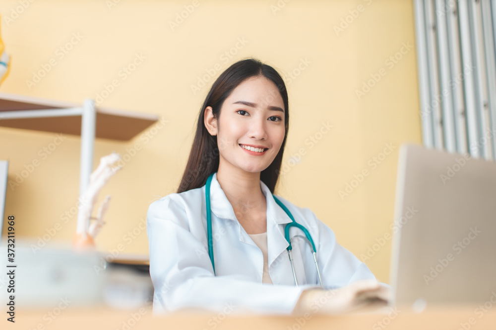 Medicine and health care concept. Asian doctor is taking care patient woman in hospital.doctor or nurse wear protection mask checking and takecare infection people from covid-19 . Medicine and health care concept. Asian doctor is taking care patient woman in hospital.doctor or nurse wear protection mask checking and takecare infection people from covid-19 .
