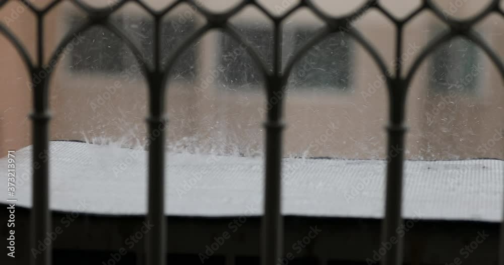 A shower raindrops falling over a plastic cover A shower raindrops falling over a plastic cover