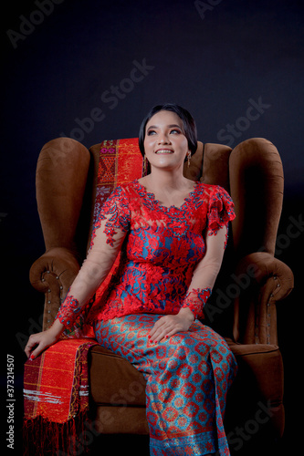 portrait of beautiful indonesian women wearing traditional batak costume