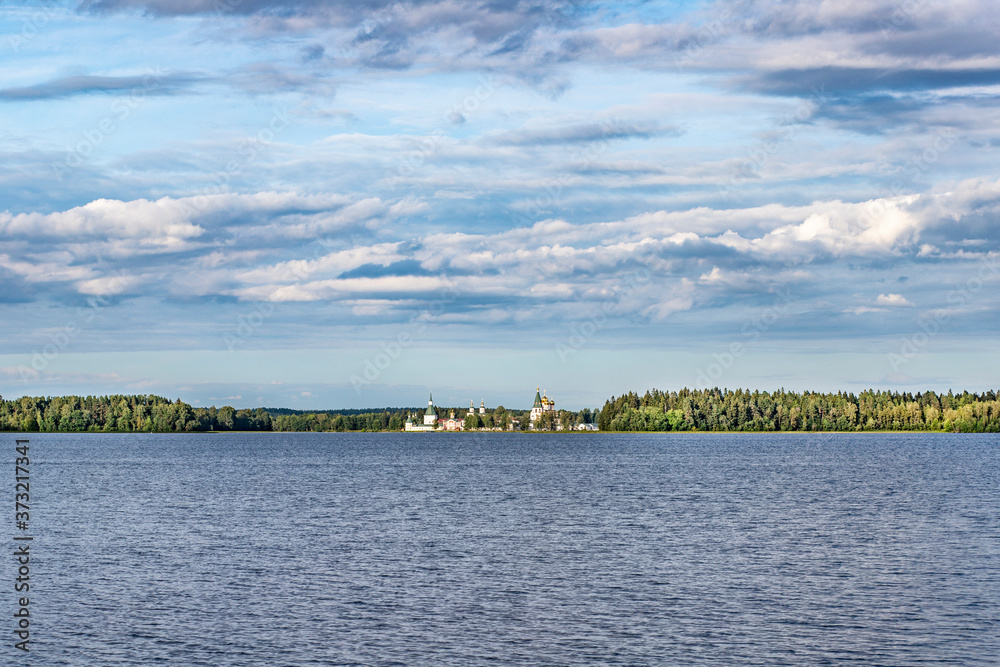 Landscape of Valdai lake with a Christian church located on the opposite bank