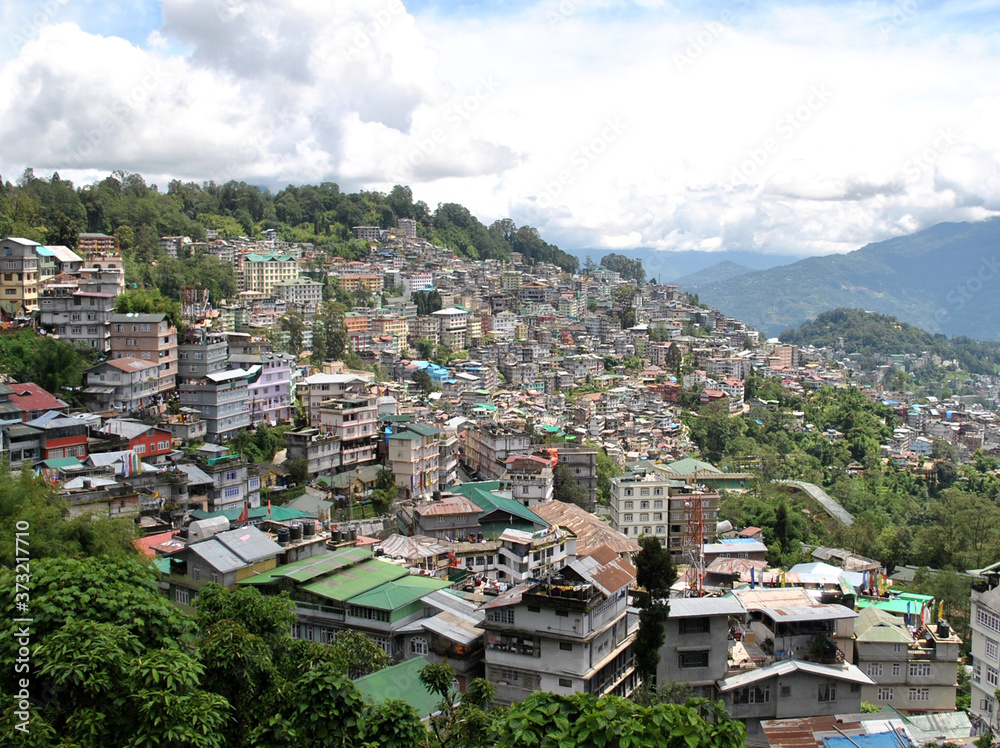 A view of Gangtok city, capital of Sikkim situated in the Himalayan terrain of concrete structures looks amazing as seen from Zero Point in Gangtok. Sikkim is famous for its peaceful & clean state.