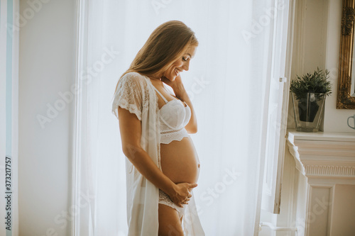 Pretty young pregnant woman...