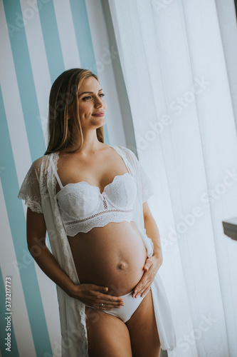 Pretty young pregnant woman...