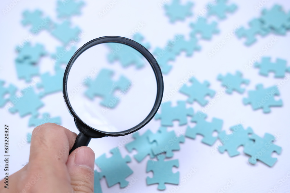 Businessman to connect couple puzzle piece on table background. one part of whole.symbol of association and connection.business strategy Businessman to connect couple puzzle piece on table background. one part of whole.symbol of association and connection.business strategy