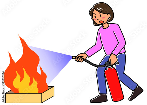 消火器で火を消す女性