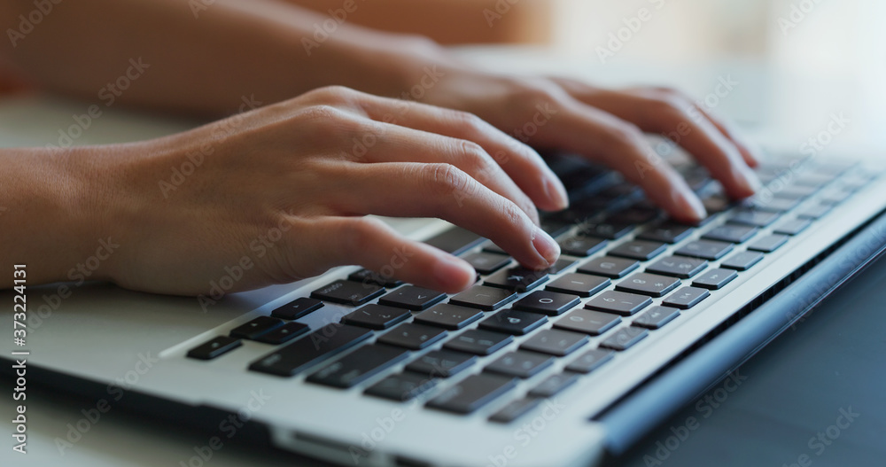 Woman type on laptop computer, work from home concept