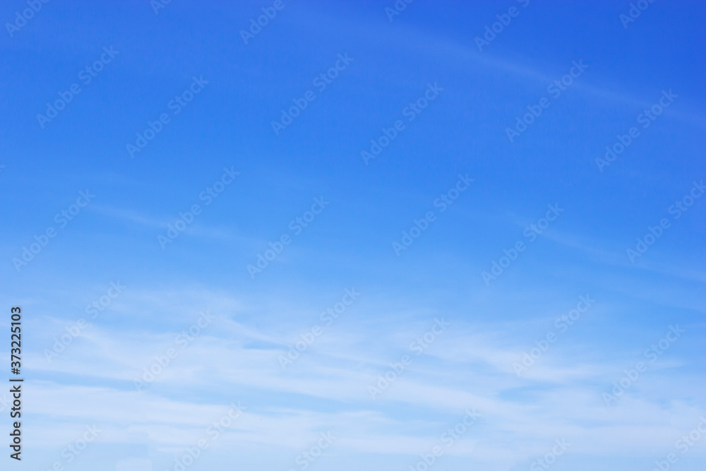 Blue sky background and white clouds soft focus, and copy space