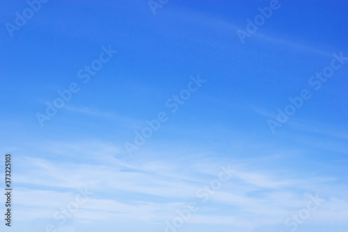 Blue sky background and white clouds soft focus, and copy space photo