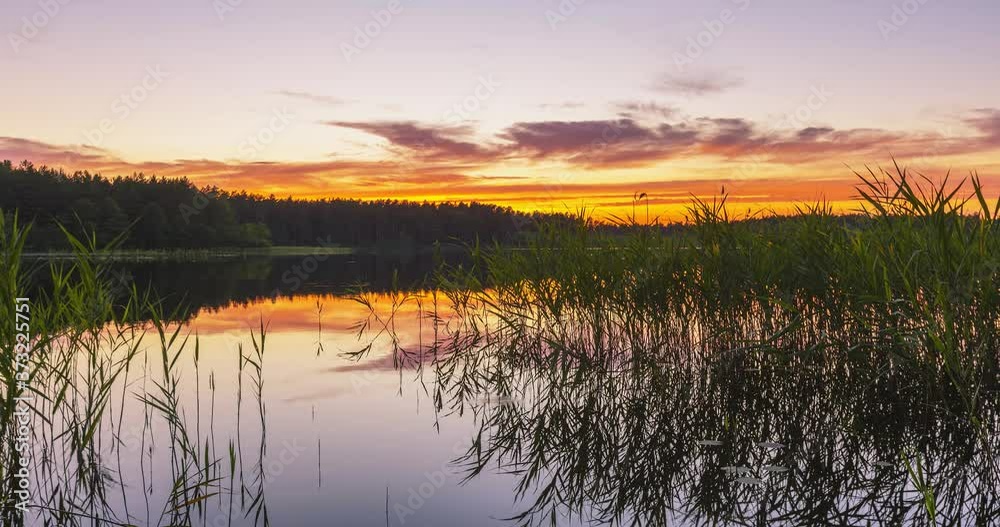 Timelapse of sunrise in the calm lake, evening harmony Timelapse of sunrise in the calm lake, evening harmony
