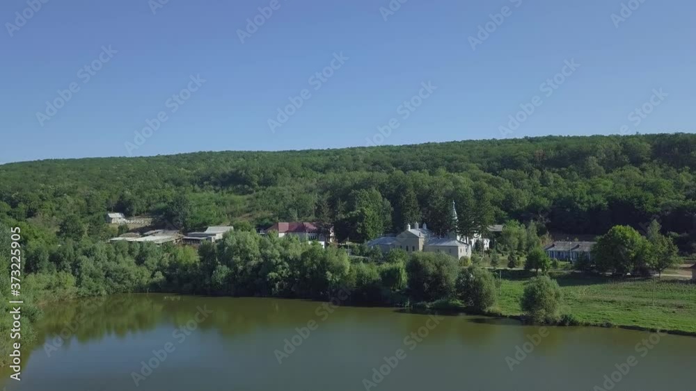 Aerial view of christian monastery. The lake and a view of the Thiganeshty Monastery. Moldova. Aerial view of christian monastery. The lake and a view of the Thiganeshty Monastery. Moldova.