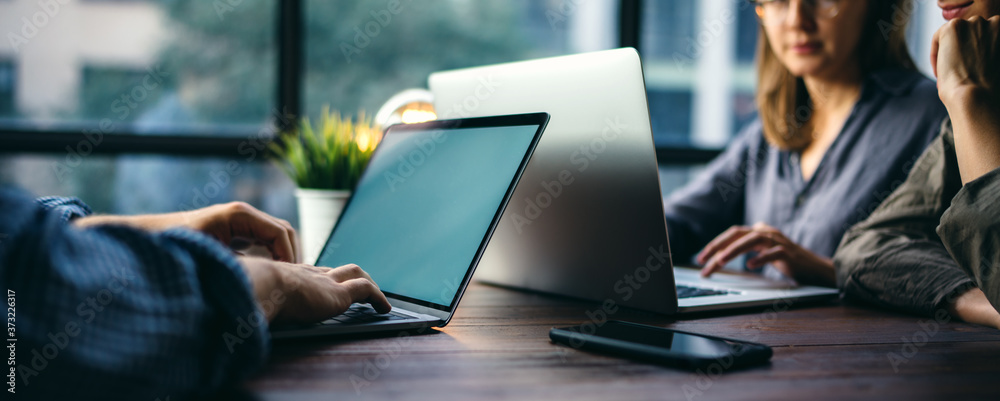 © Rymden - Group of young people working together. Creative business people in modern office © Rymden - Group of young people working together. Creative business people in modern office