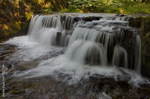 Fototapeta Naklejka Na Ścianę i Meble -  Mohelnice waterfall, small river Mohlenice, Beskydy mountains, Czech Republic