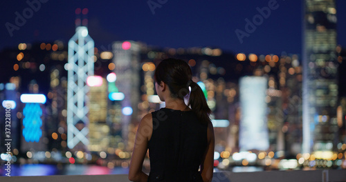 Photography Woman look at the city in the evening
