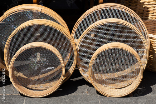 Closeup shot of traditional type sieves made of wood photo