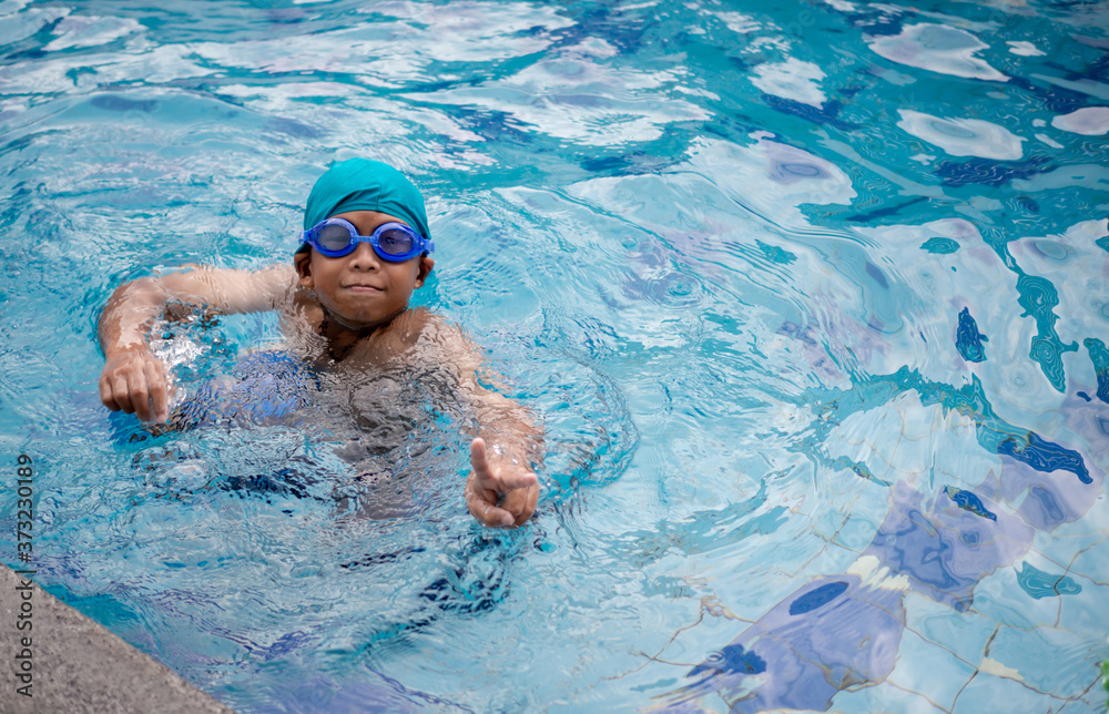 A boy swimming in the pool