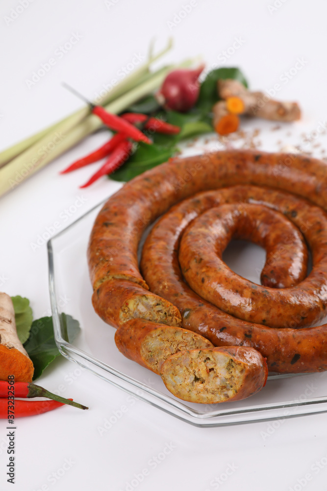 Fototapeta premium Local Northern Thai food , Northern Thai spicy sausage street food isolated in white background