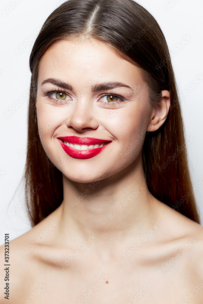 Charming woman Nude shoulders smile red lips studio clear skin Charming woman Nude shoulders smile red lips studio clear skin