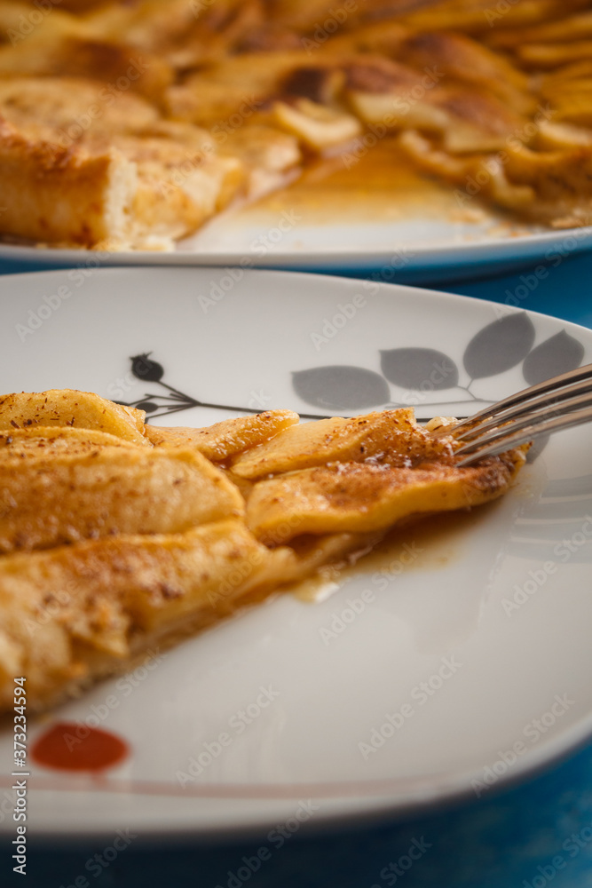 Homemade organic pie with apples puff pastry, cinnamon and butter. Delicious apple puff with blue background. Homemade organic pie with apples puff pastry, cinnamon and butter. Delicious apple puff with blue background.