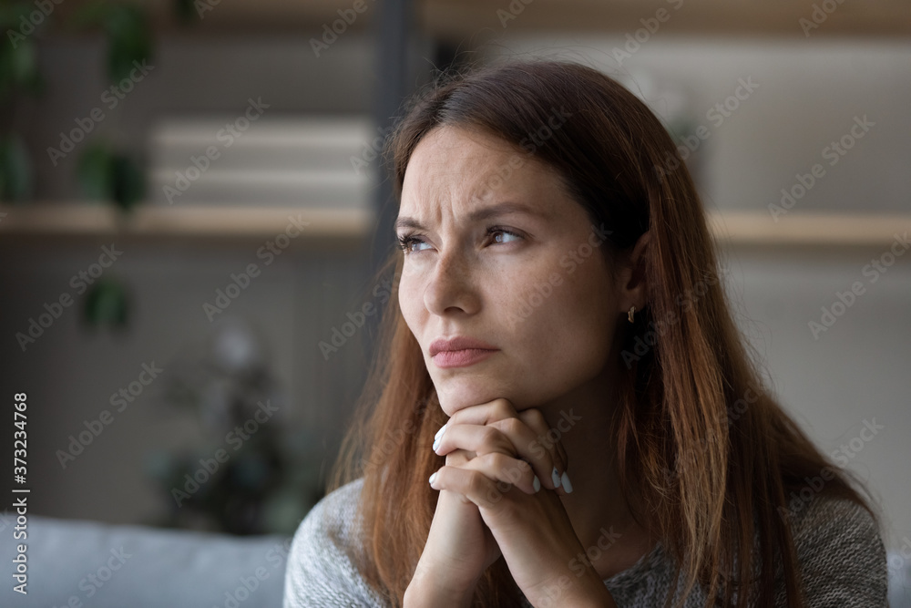 Unhappy young red-haired Caucasian woman look in distance thinking of life problems troubles, upset millennial female pondering at home, feel worried anxious, struggle with difficulties Unhappy young red-haired Caucasian woman look in distance thinking of life problems troubles, upset millennial female pondering at home, feel worried anxious, struggle with difficulties