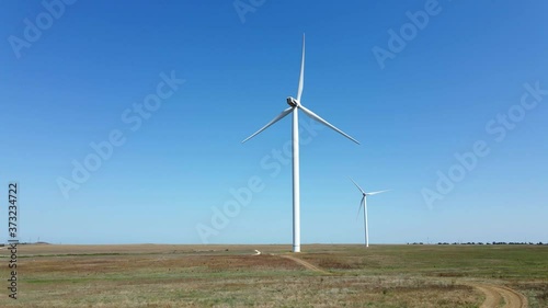 Wallpaper Mural working wind turbines standing on the field in summer in Russia Torontodigital.ca