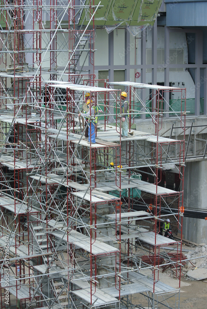 JOHOR, MALAYSIA -APRIL 13, 2016: Scaffolding used as the temporary structure to support platform, form work and structure at the construction site. Also used it as a walking platform for workers.
JOHOR, MALAYSIA -APRIL 13, 2016: Scaffolding used as the temporary structure to support platform, form work and structure at the construction site. Also used it as a walking platform for workers.