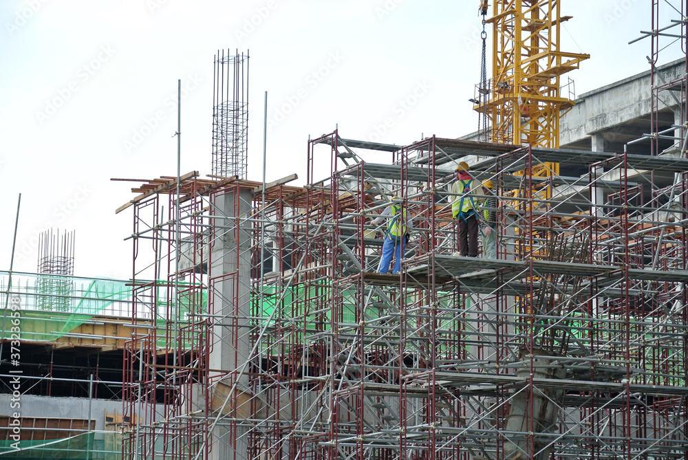 JOHOR, MALAYSIA -APRIL 13, 2016: Scaffolding used as the temporary structure to support platform, form work and structure at the construction site. Also used it as a walking platform for workers.
JOHOR, MALAYSIA -APRIL 13, 2016: Scaffolding used as the temporary structure to support platform, form work and structure at the construction site. Also used it as a walking platform for workers.