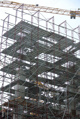 Wallpaper Mural JOHOR, MALAYSIA -APRIL 13, 2016: Scaffolding used as the temporary structure to support platform, form work and structure at the construction site. Also used it as a walking platform for workers. 
 Torontodigital.ca