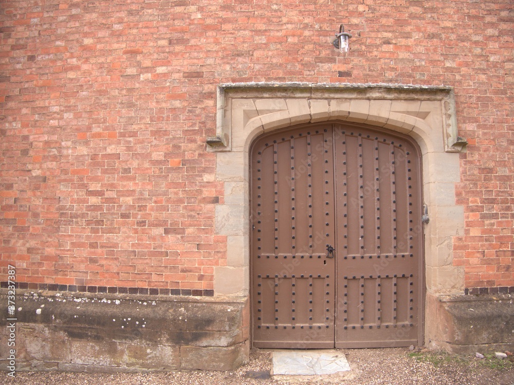 old wooden door red brick background texture old wooden door red brick background texture