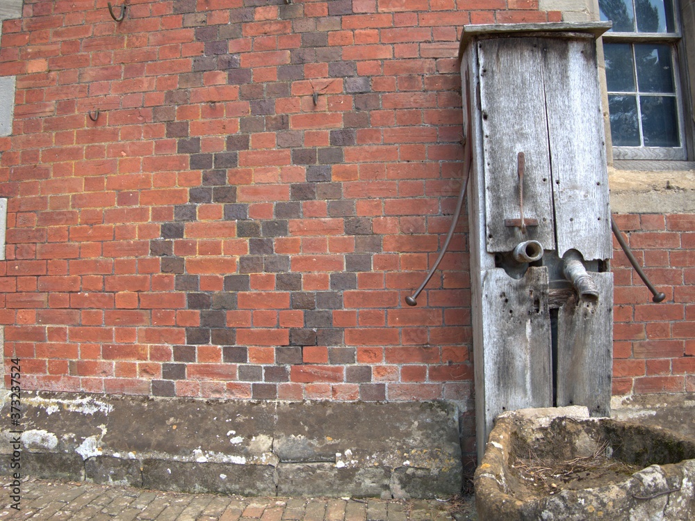 old brick wall with well background texture old brick wall with well background texture