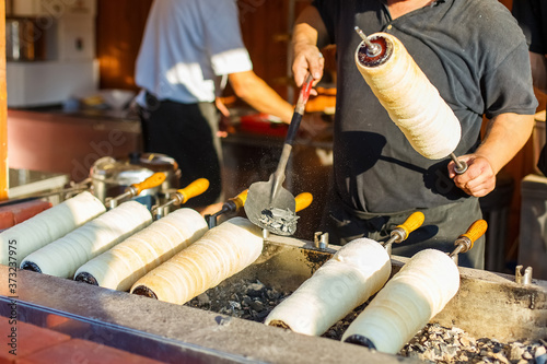 Hungarian traditional street food baking pastry kurtosh kalach or trdelnik photo