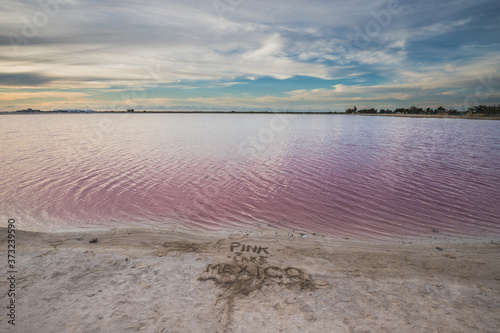 Las Coloradas, salt pink lagoon, beautiful pink water and clear blue sky near Rio Lagartos, Yucatan, Mexico photo