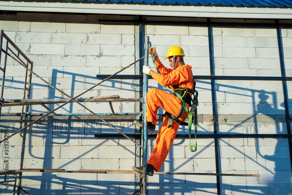 Fototapeta premium Construction workers wearing safety line during working at construction site.