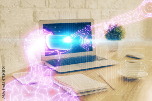 Computer on desktop with AR theme icon. Multi exposure. Concept of augmented reality. © peshkova