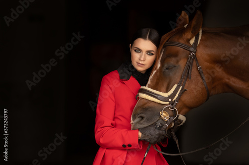 Sensual photo young woman rider and horse, concept of mutual understanding of girl and animal, antistress therapy