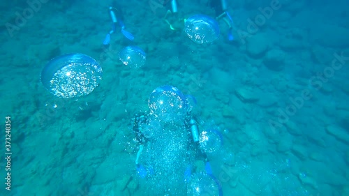 Fethiye, Turkey - 30th of July 2020: 4K Plenty of big and small air bubbles rise up from the scuba divers at the deeps
