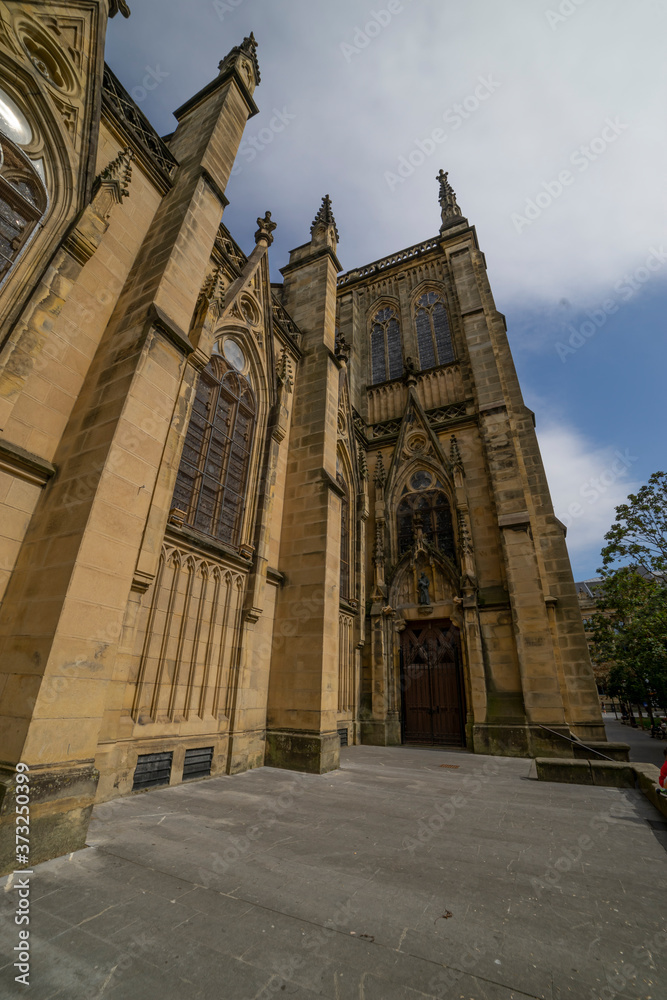 Buen Pastor Cathedral in the city of San Sebastian, Basque Country, Spain. side of church with stained glass windows at sunset Buen Pastor Cathedral in the city of San Sebastian, Basque Country, Spain. side of church with stained glass windows at sunset