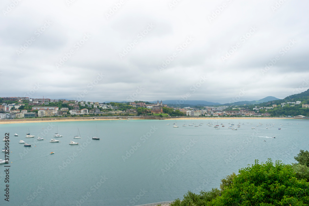 Coastline, view of the city of San Sebastian, with La Concha beach, from Mount Urgull. Summer vacation scene in Spain