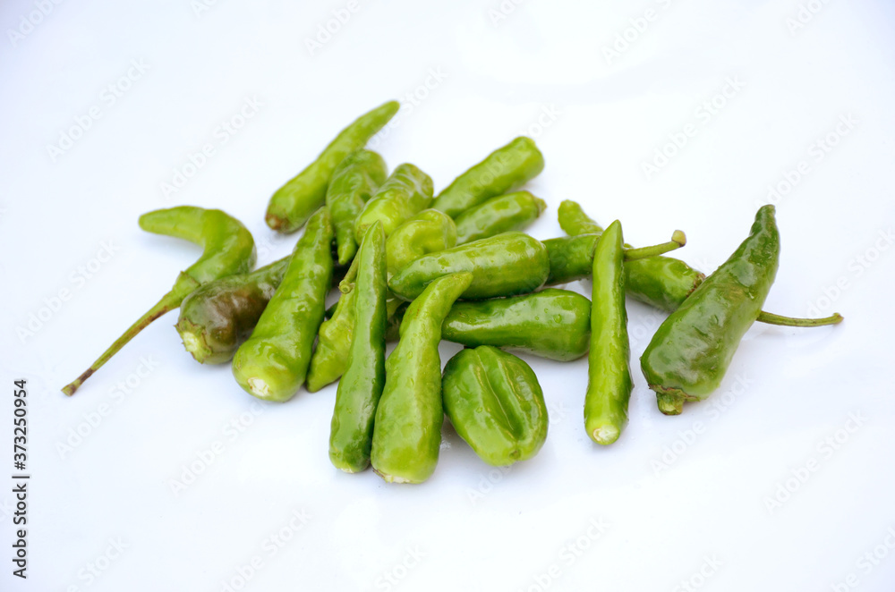 bunch bunch the green ripe chilly isolated on white background. bunch bunch the green ripe chilly isolated on white background.