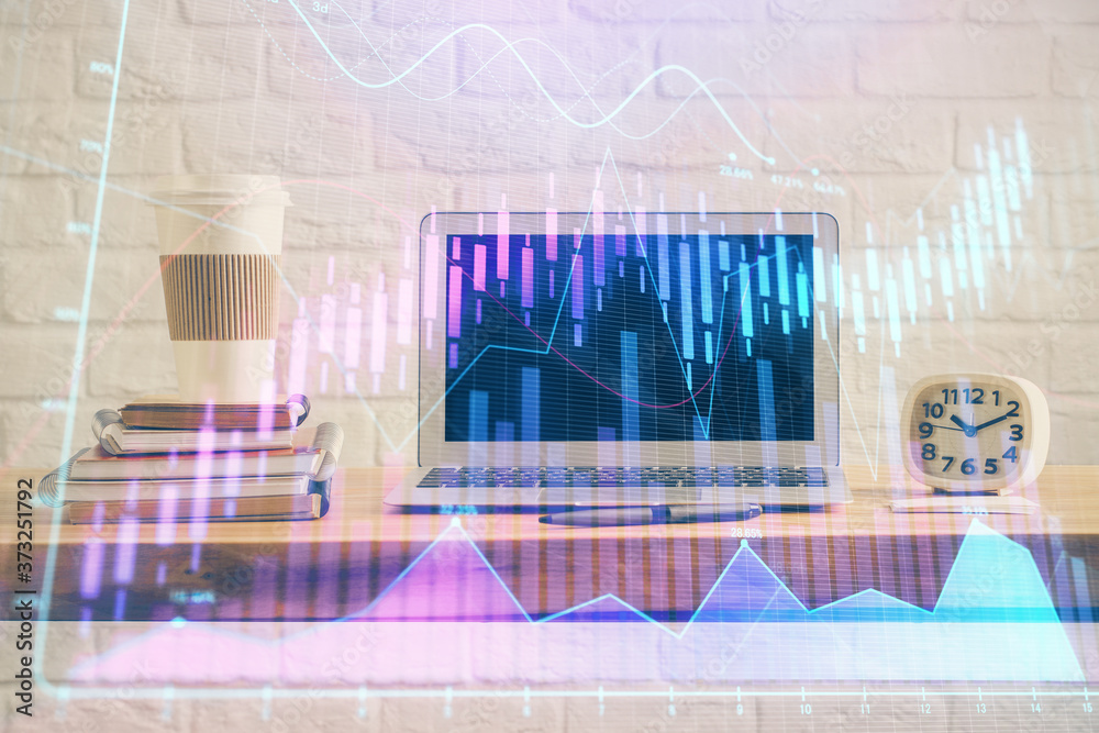Forex market graph hologram and personal computer on background. Multi exposure. Concept of investment. Forex market graph hologram and personal computer on background. Multi exposure. Concept of investment.