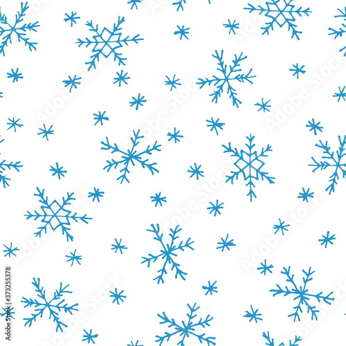 Blue snowflakes isolated on white background. Christmas seamless pattern. Hand drawn doodle. Winter design for textile, wrapping paper, fabric. Stock vector illustration