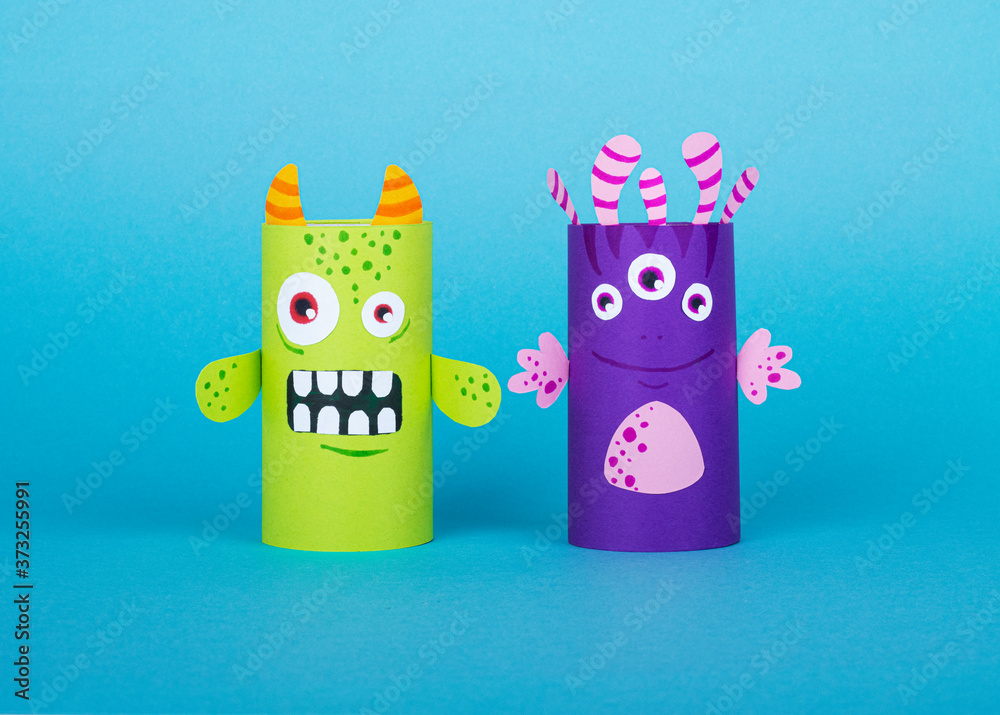 Obraz premium colorful monsters made out of toilet paper on a blue background