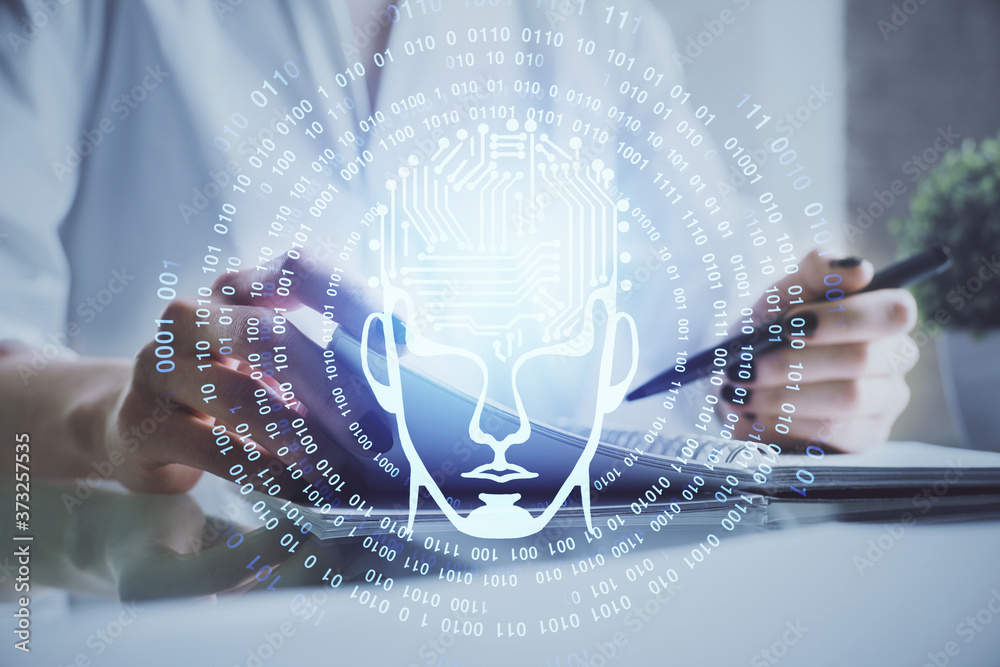 Multi exposure of writing hand on background with brain hologram. Concept of self learning.