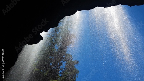 Under the waterfall