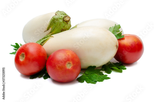 White eggplants with tomatoes on white isolated background