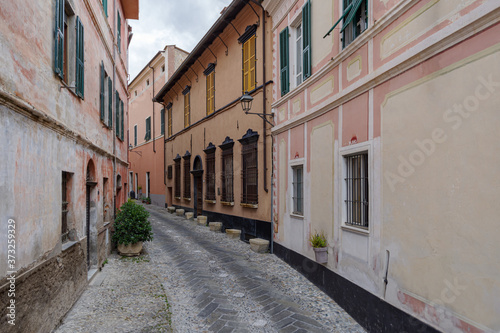 Typical Italian narrow street, Diano Castello ancient village, Province of Imperia, Italy
