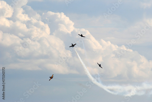 airshow planes group with smoke against the blue sky