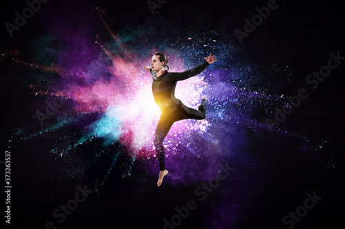 Male dancer against colourf...