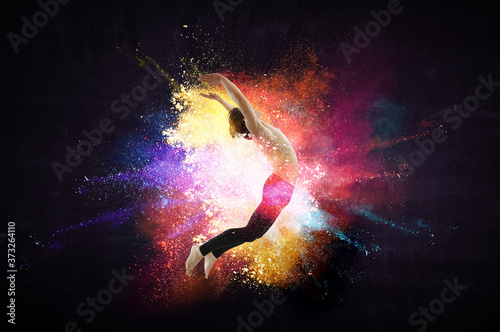 Male dancer against colourf...