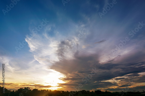 Sunrise sky over agricultural field.