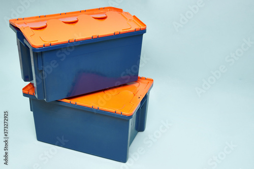 Plastic storage boxes. Boxes for the delivery of products. Orderly storage.